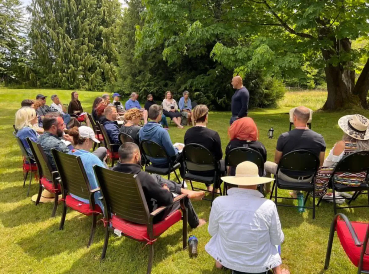 Satyen Raja teaching a group session outdoors